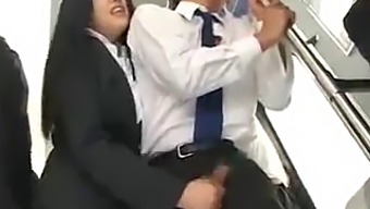 Asian Beauty Gives A Handjob To A Lucky Passenger On A Public Bus