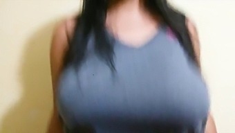A Stunning Busty Woman Showcases Her Assets In A Solo Performance